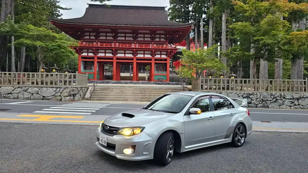 A JDM Subaru WRX Sti in front of a Temple in Kyoto